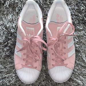 Pink and white Adidas superstar